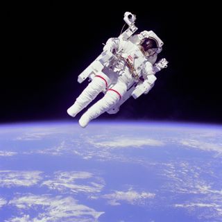 Astronaut Bruce McCandless made the first untethered spacewalk as he flew about 300 feet from the shuttle in the first test of the Manned Maneuvering Unit on Feb. 7, 1984. The event pictured here took place a few days later on February 11.