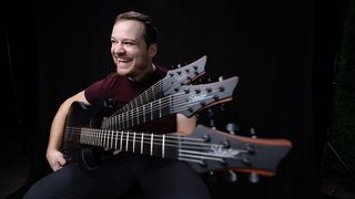 Rob Scallon sitting with three guitars on his lap