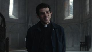 Josh O'Connor smiling in Wake Up Dead Man