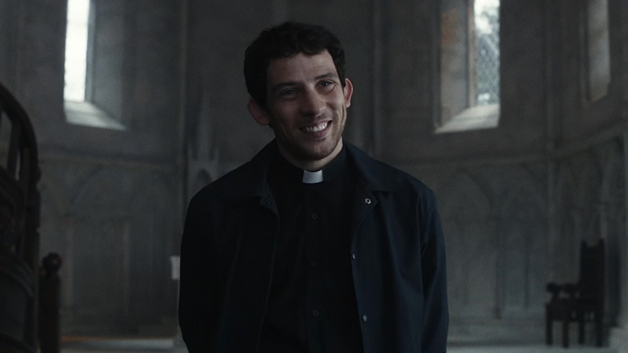 Josh O'Connor smiling in Wake Up Dead Man