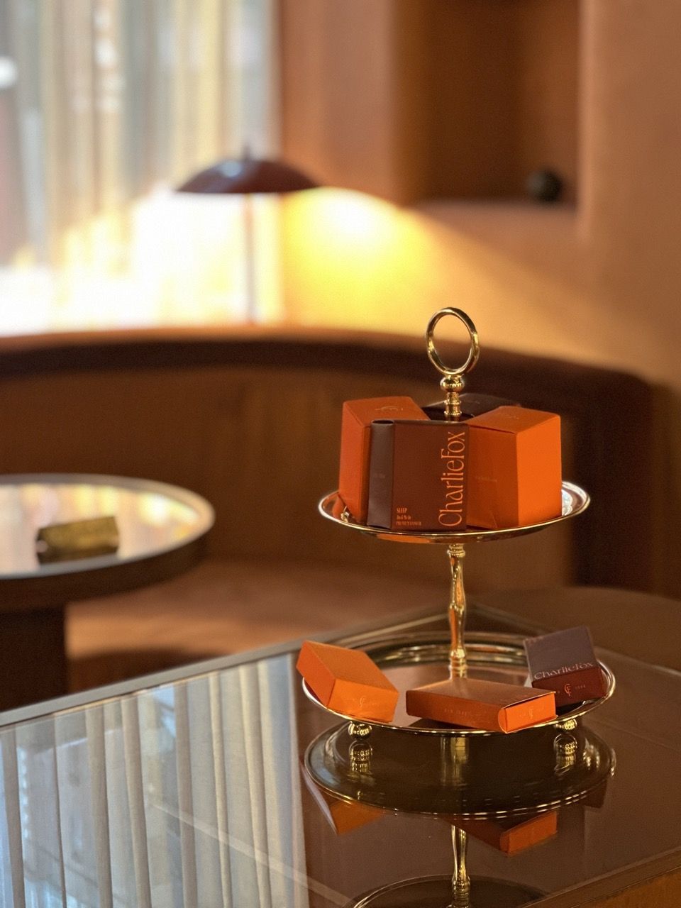 A close up of Charlie Fox packaged goods displayed on a tiered metal tray.