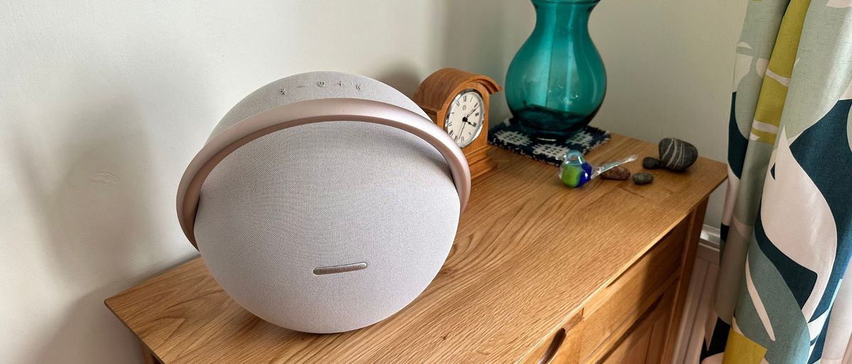 Harman Kardon Studio Onyx 8 on a wooden side table