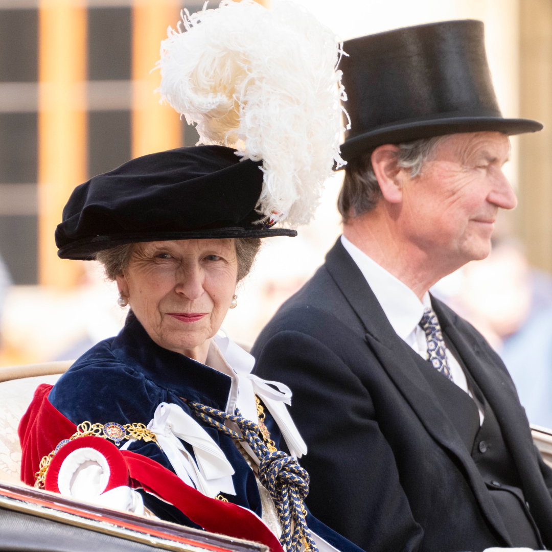 Princess Anne rides in a carriage with husband Sir Timothy Laurence