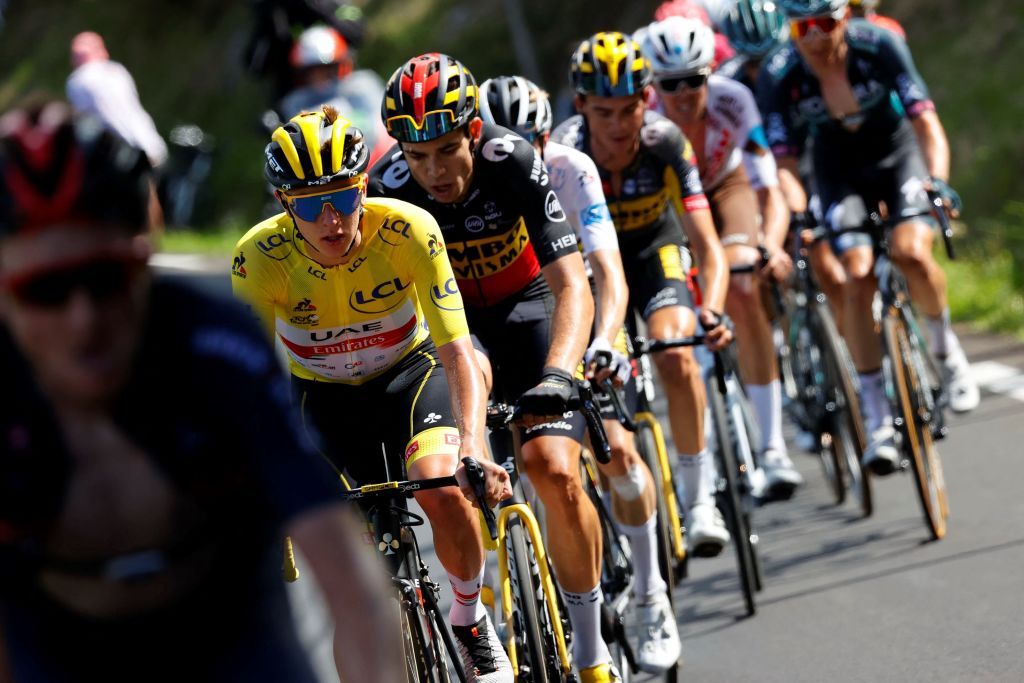 Team UAE Emirates Tadej Pogacar of Slovenia wearing the overall leaders yellow jersey rides in the pack during the 18th stage of the 108th edition of the Tour de France cycling race 129 km between Pau and Luz Ardiden on July 15 2021 Photo by Thomas SAMSON AFP Photo by THOMAS SAMSONAFP via Getty Images