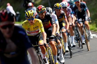 Team UAE Emirates Tadej Pogacar of Slovenia wearing the overall leaders yellow jersey rides in the pack during the 18th stage of the 108th edition of the Tour de France cycling race 129 km between Pau and Luz Ardiden on July 15 2021 Photo by Thomas SAMSON AFP Photo by THOMAS SAMSONAFP via Getty Images