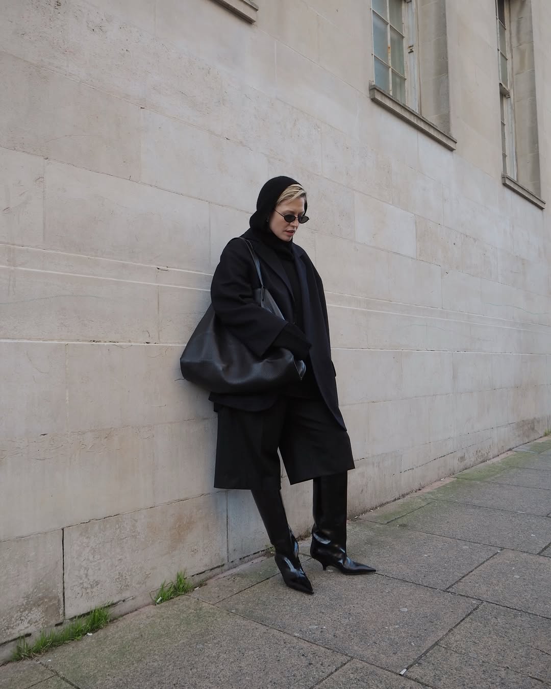 Alexis in a black knitted hood