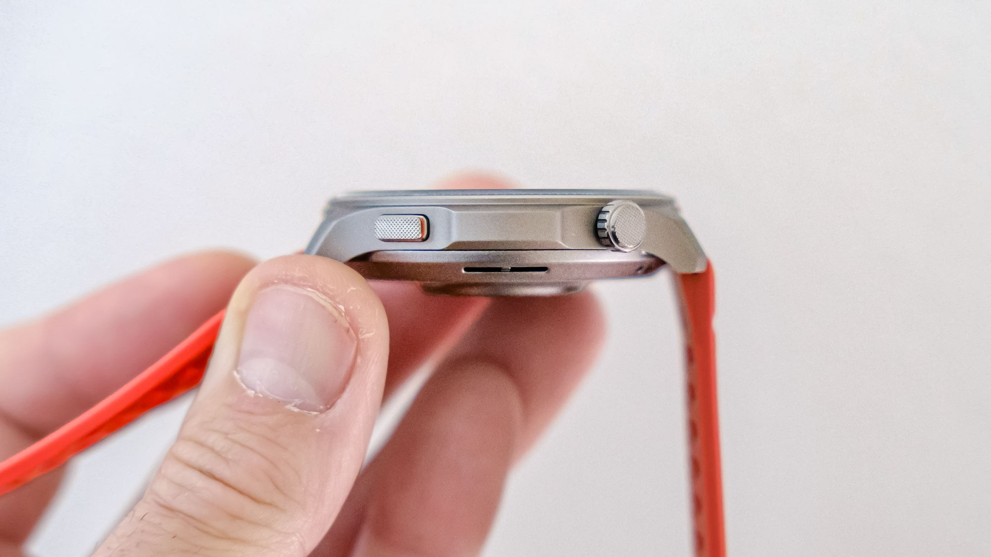 Close-up of the Amazfit Balance 2 smartwatch on an orange rubber strap