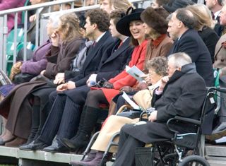 Kate Middleton wears a bright red coat to attend Prince William's pass out parade at Sandhurst on December 15, 2006