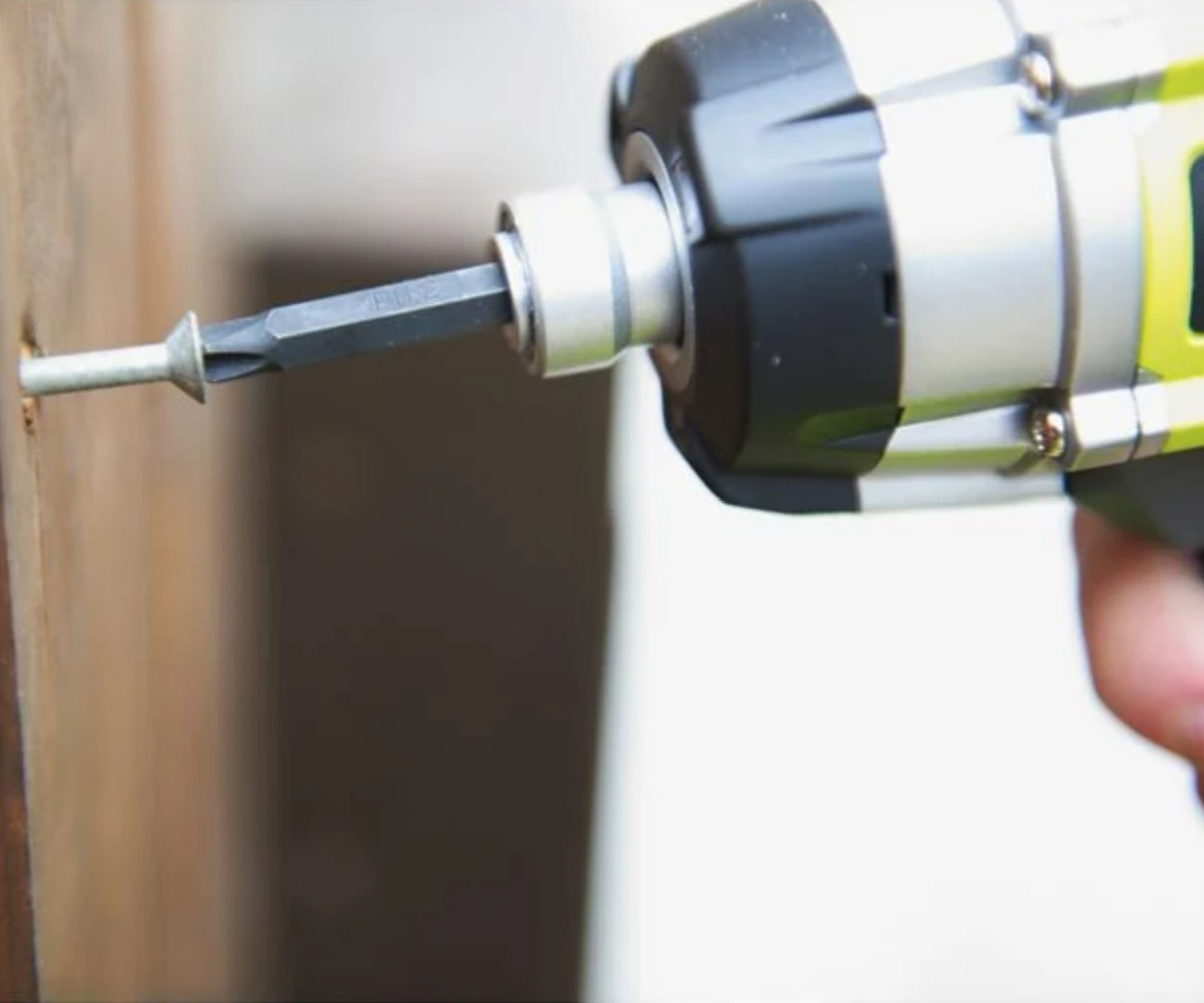 RYOBI 18V ONE+ Cordless Impact Driver being used on a screw in wood