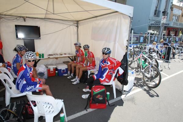 Great Britain's riders sit around in the shade before the race.