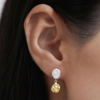 flat lay image of gold earings