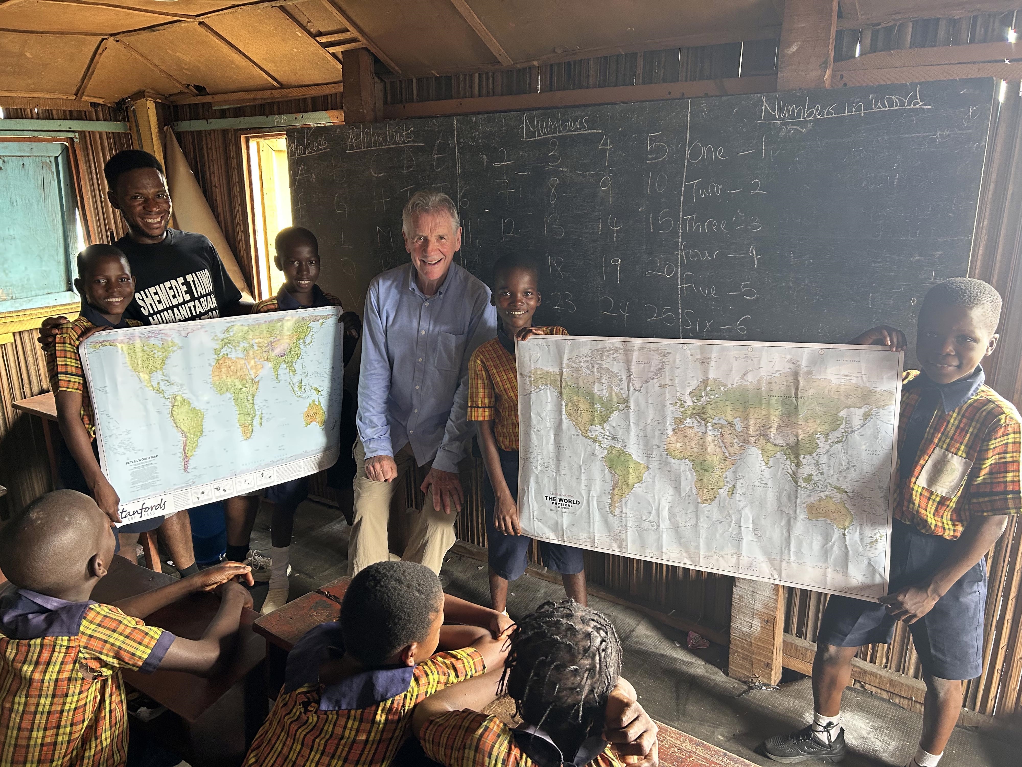 Michael meets schoolchildren in Nigeria.