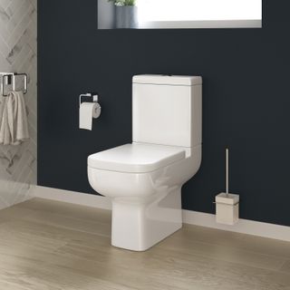 A close-coupled toilet in white