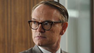 Jared Harris looking at something concerning off screen in Mad Men.
