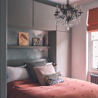 Bedroom storage with built-in cupboards around bed.