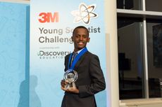 Heman Bekele holds his trophy for winning the 3M Young Scientist Challenge