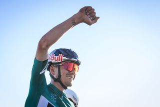 Team Q36.5 Pro Cycling Team British rider Tom Pidcock celebrates after winning the overall AlUla Tour cycling race, after the fifth stage of the race from AlUla Camel Cup track to AlUla Camel Cup track on February 1, 2025. (Photo by Loic VENANCE / AFP)