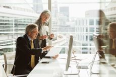 An older man working in an office