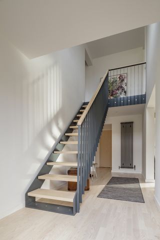steel modern staircase ideas in an extended home
