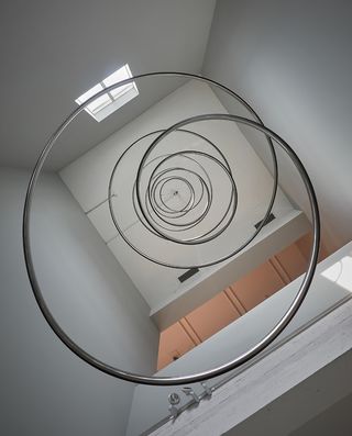 Metal spiral ceiling art work