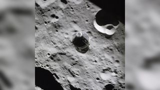 The Apollo 16 Lunar Module captured this image of the Command and Service Modules from above just after undocking, with the lunar surface in the background.