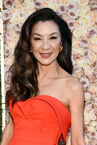 Michelle Yeoh is seen with shiny, curly hair at the 81st Golden Globe Awards held at the Beverly Hilton Hotel on January 7, 2024 in Beverly Hills, California.
