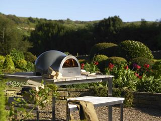 pizza oven in outdoor kitchen