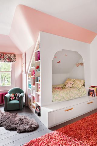 Pink and orange kids bedroom with built in bed