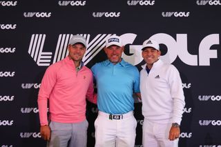 Kaymer, Westwood and Garcia pose in front of the LIV Golf banner
