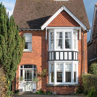 house with red wall and windows