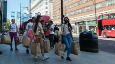 Customers leave the Primark store on Oxford Street, London, in June 2020