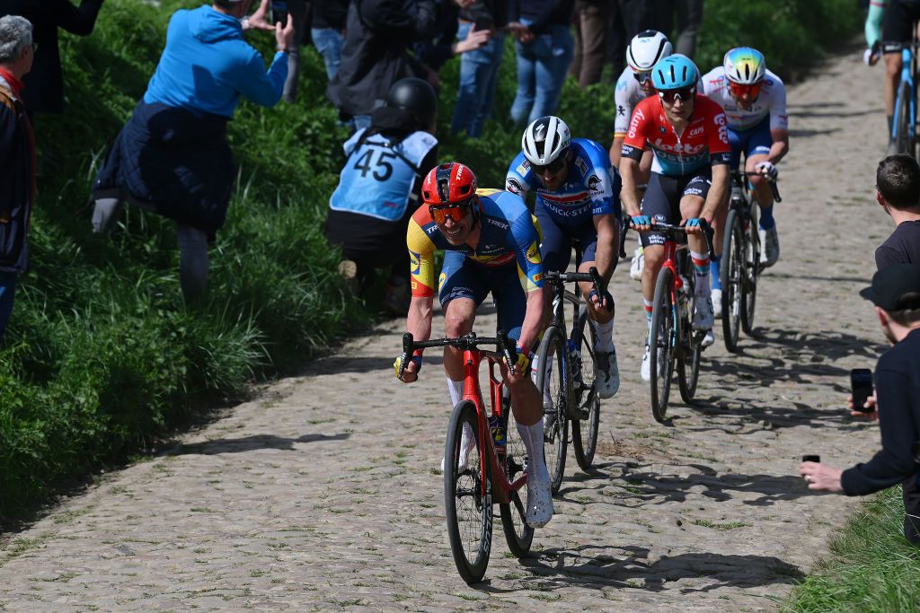 ROUBAIX FRANCE APRIL 07 LR Tim Declercq of Belgium and Team Lidl Trek and Gianni Moscon of Italy and Team Soudal QuickStep compete passing through the Viesly Quivy cobblestones sector during the 121st ParisRoubaix 2024 a 2597km one day race from Compiegne to Roubaix UCIWT on April 07 2024 in Roubaix France Photo by Dario BelingheriGetty Images