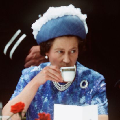 Queen Elizabeth drinking tea