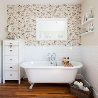 bathroom with white tiles and bathtub
