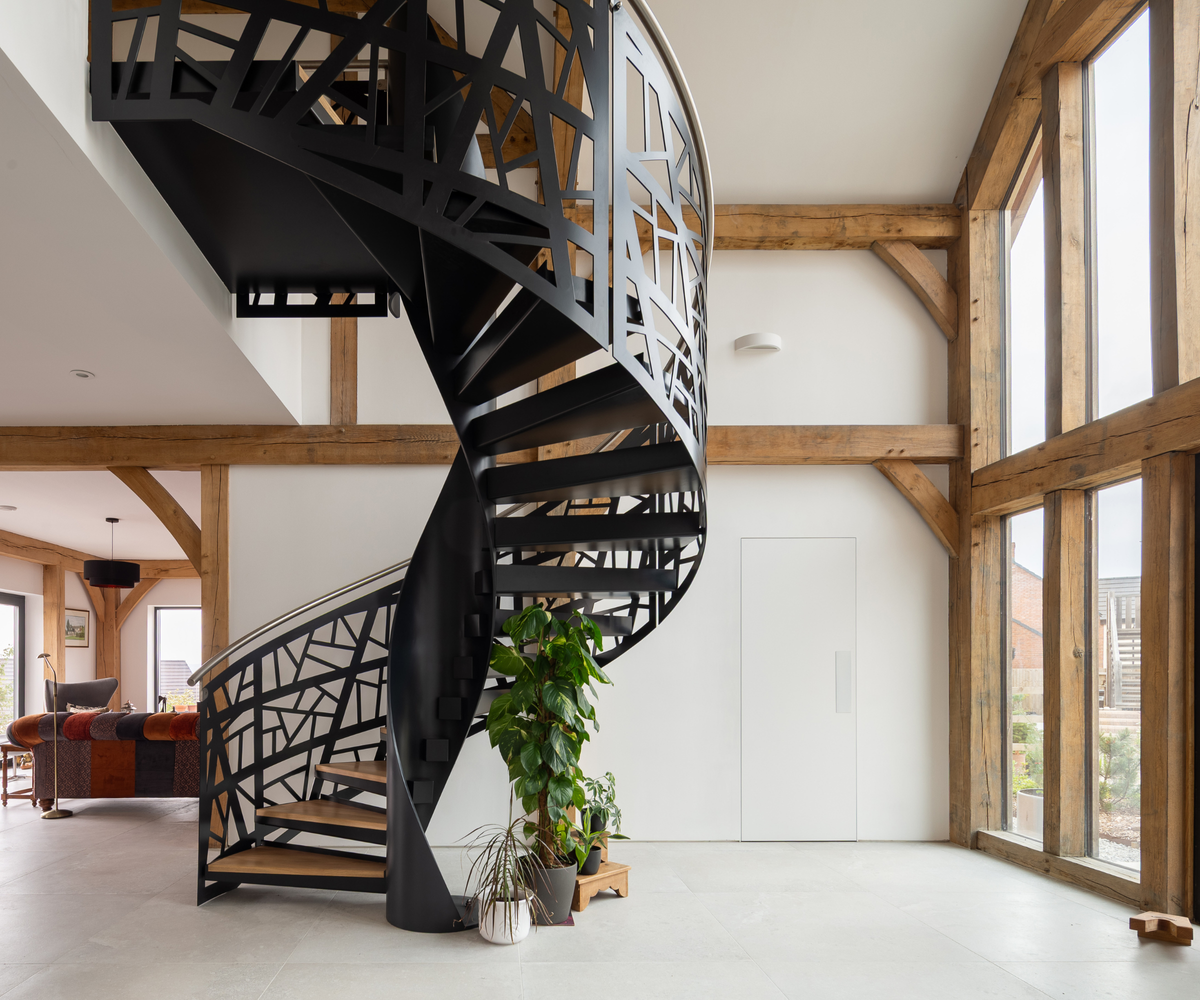 Front entrance with curved black staircase
