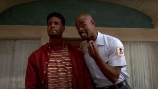 Shawn Wayans stands seriously while Keenan Ivory Wayans pulls a face in Don't Be A Menace.