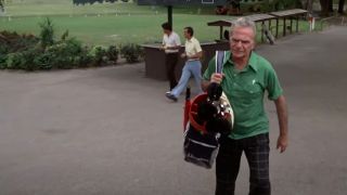 The bishop in Caddyshack carrying his golf bag