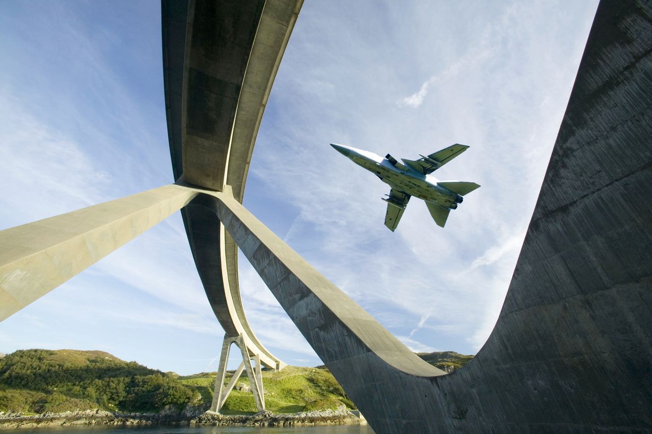 ylesku Bridge in Assynt Scotland UK, with an RAF jet flying past