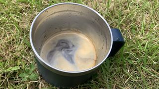 Camping mug full of coffee