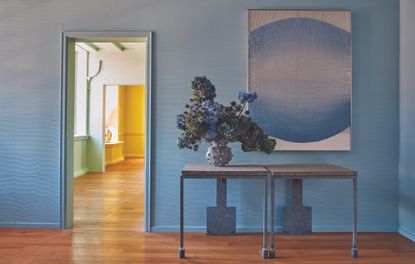 A passageway with blue wall paint and yellow interior walls