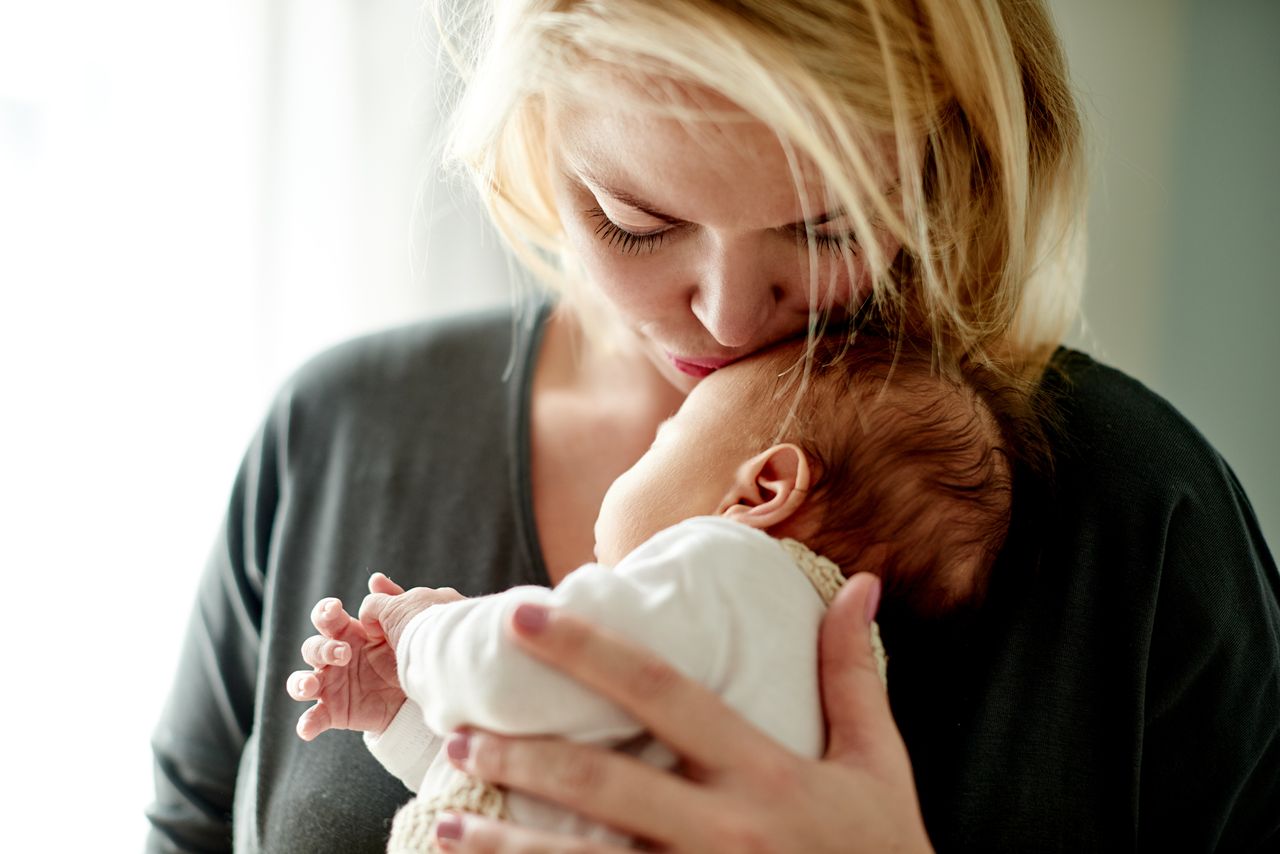 mum holding baby