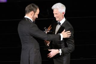 Designer Tom Ford (L) and Richard Buckley appear onstage at the 2014 CFDA fashion awards at Alice Tully Hall, Lincoln Center on June 2, 2014 in New York City.