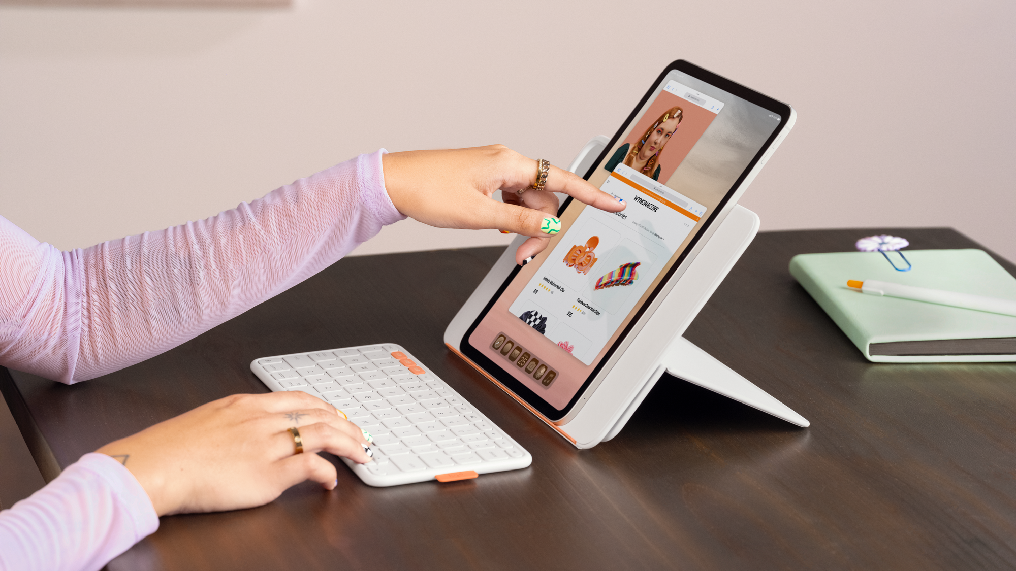 A person uses the Logitech Flip Folio at a desk.