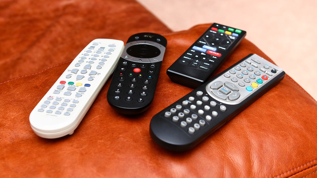 Remote controls on a leather sofa