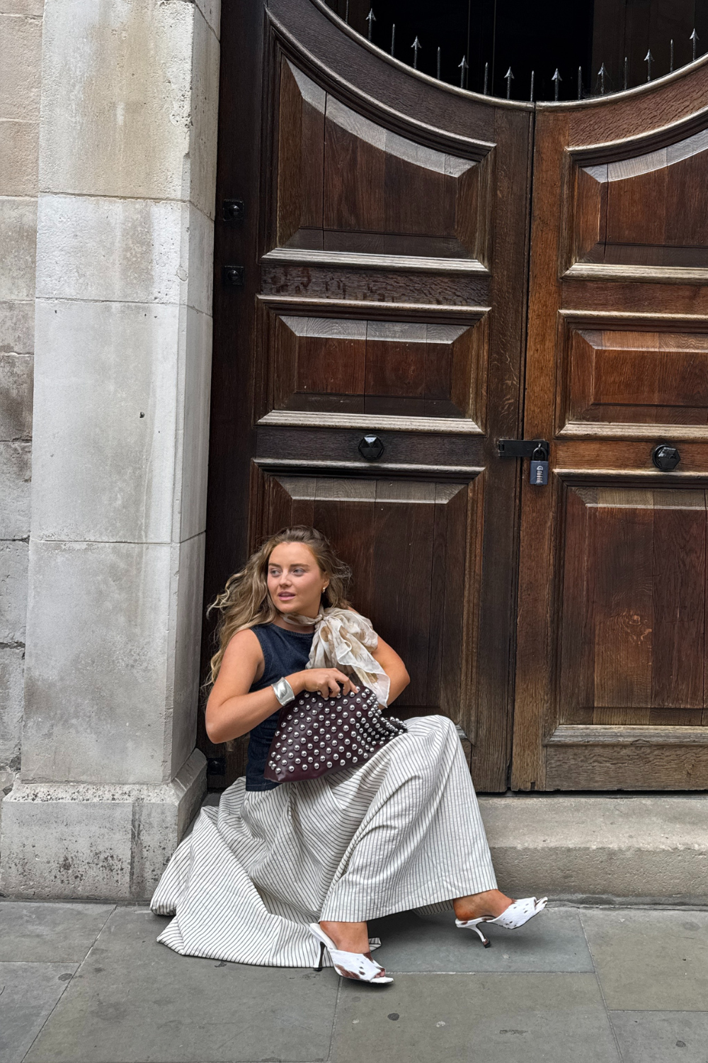 Lauren Cunningham wears cow print mules