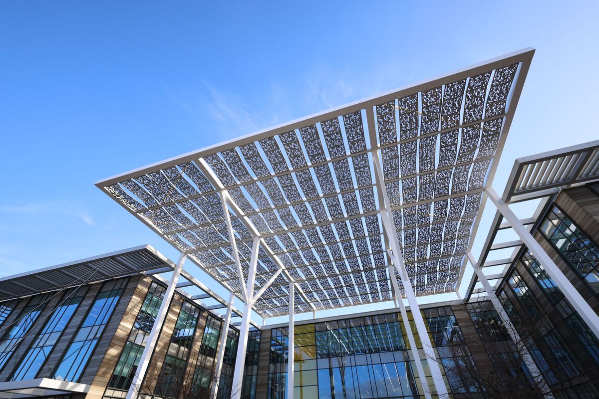 A rain cover over the front of a glass office building