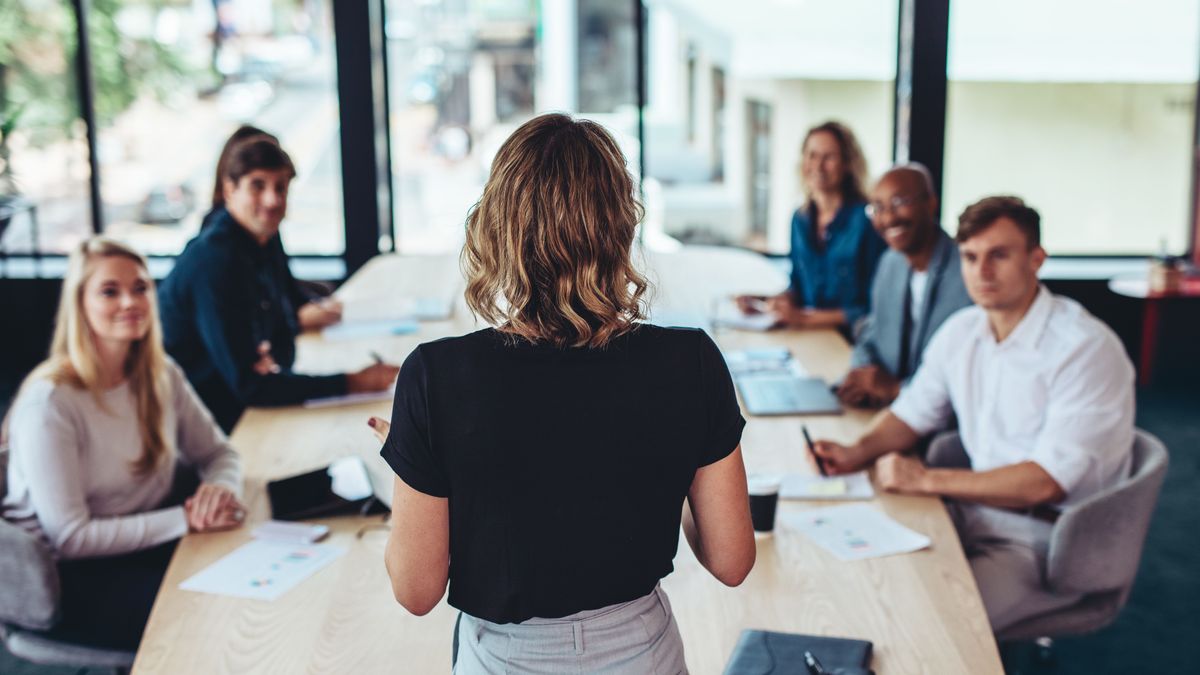 Woman in the workplace leading a meeting