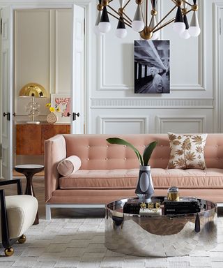 A Chrome coffee table paired with an earthy pink sofa