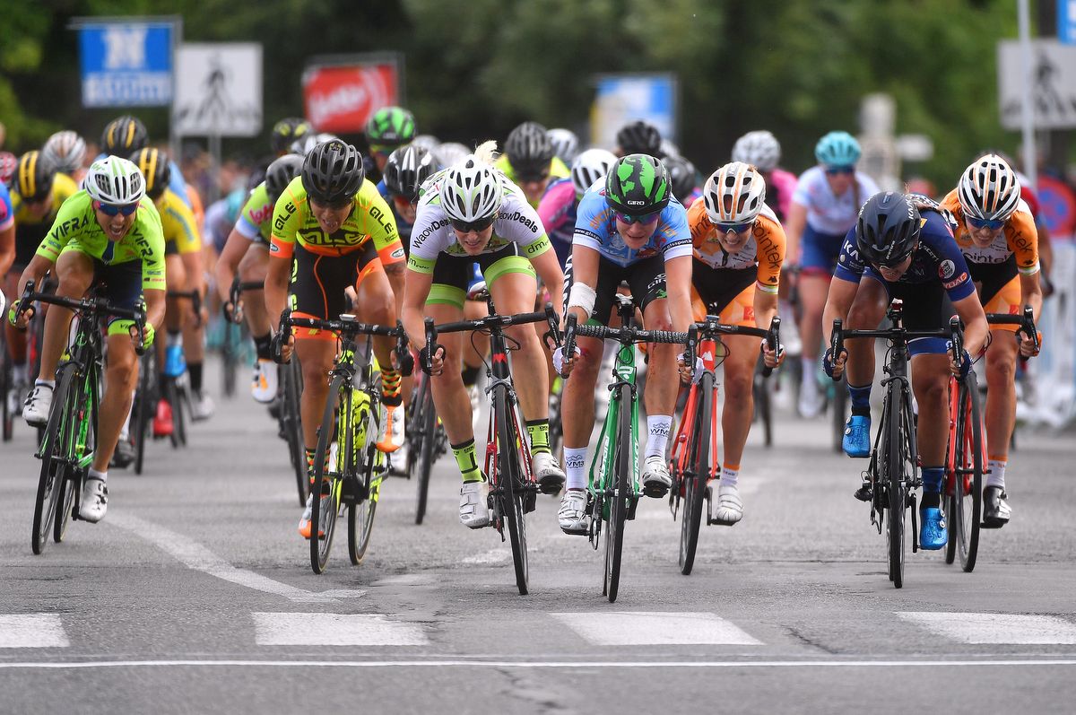 Marianne Vos (WM3 Pro Cycling) throws her bike at the line