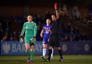 Manchester United goalkeeper Sophie Baggaley (left) is shown a red card